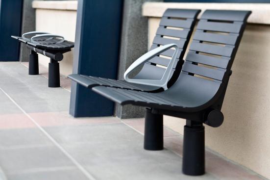 Tecno RS Seating System shown in two-seat, backed configuration with Black Texture powdercoated frame and seats, Silver Texture powdercoated angled armrests, and cylindrical mounting posts at Sound Transit, Seattle, Washington