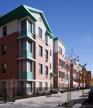 Prospect Plaza-Brooklyn, NY&nbsp; Prospect Plaza is a multifamily building designed to resemble a series of townhouses, occupying one entire city block in the Ocean Hill/Brownsville area of Brooklyn, NY. The building's appearance is a fusion of traditional Brooklyn brownstone design with more modern elements within the setback. This better articulates the facades along the street and revitalizes the community with a more refreshed appearance. Canopied entrances with front stoops employ colors to differentiate between residences and rear yards and outdoor areas afford residents greater community interaction. 
Architect: IMagnusson Architecture and Planning PC