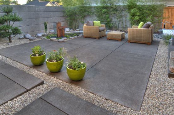 Drought-tolerant plants and permeable surfacing keep this relaxing backyard eco-friendly. A 1,000-gallon cistern (top right) lends a modern, industrial feel while supplying water for plants and for the landscape pond (top left). 