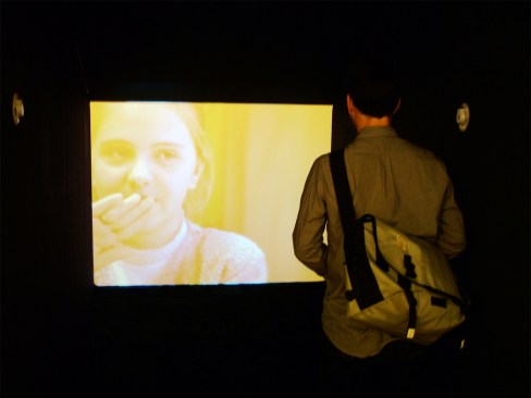 Viewer looking at video display