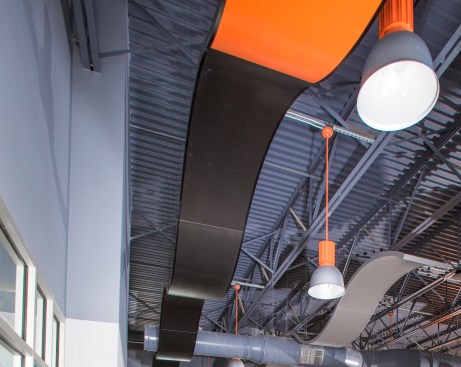 ROCKFON’s CurvGrid systems create a neat, ribbon-like appearance.