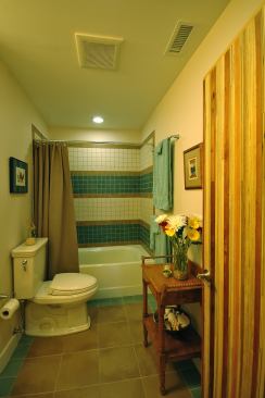 The bathrooms include Icestone countertops, American Standard low-flow faucets and showerheads, and a Toto 1.28-gpf toilet or American Standard dual-flush toilet.