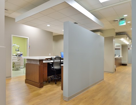 Material and color palatte from public spaces are carried through to exam areas.