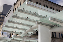 The new transit station at 5th Ave. and Atwood St. in Pittsburgh's Oakland neighborhood features a glass canopy and custom aluminum framing system engineered and fabricated by EXTECH.
