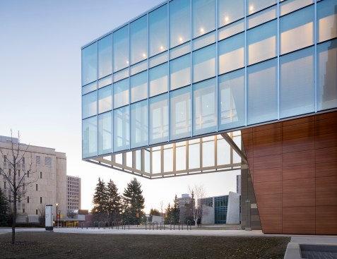 The east entrance is protected from the elements by a 55-foot cantilevered extension of the central spine.