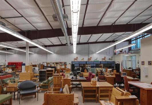 A sales floor displaying products made by prison inmates occupies most of the interior.