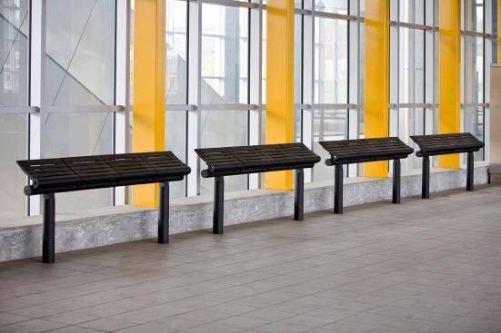 Tecno RS Seating System shown in four-seat, perch configuration with Black Texture powdercoated frame and seats and cylindrical mounting posts at Sound Transit, Seattle, Washington