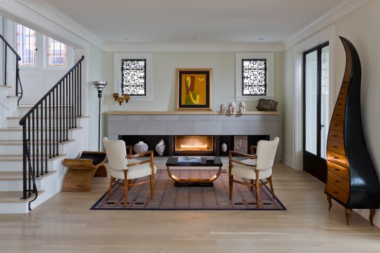 Beautiful fireplace area of white living room with art deco accents