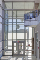 Tubelite Inc. outfitted the E&M building with seven pairs of 6-by-7-foot double doors and two 3-by-7-foot single doors.