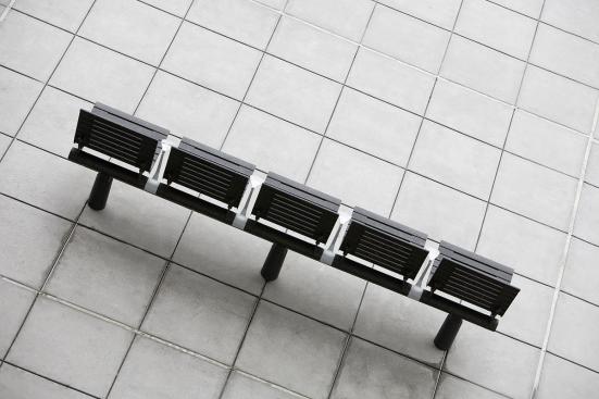 Tecno RS Seating System shown in five-seat, backed configuration with Black Texture powdercoated frame and seats, Silver Texture powdercoated angled armrests, and cylindrical mounting posts at Sound Transit, Seattle, Washington