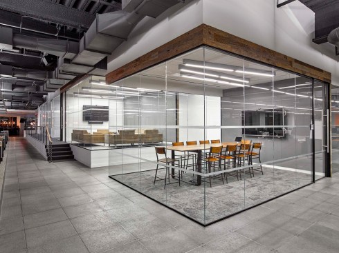 A small conference room has a more casual vibe, thanks to a bar-height table.