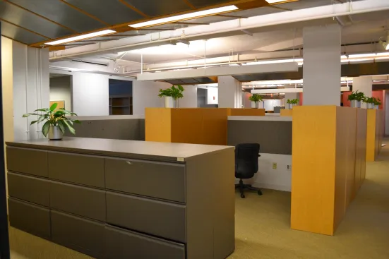 High cubicle walls divided the space and prevented collaboration.