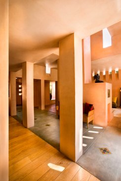 Mandeville Canyon modern home living room with natural light from clerestory portal windows and skylights