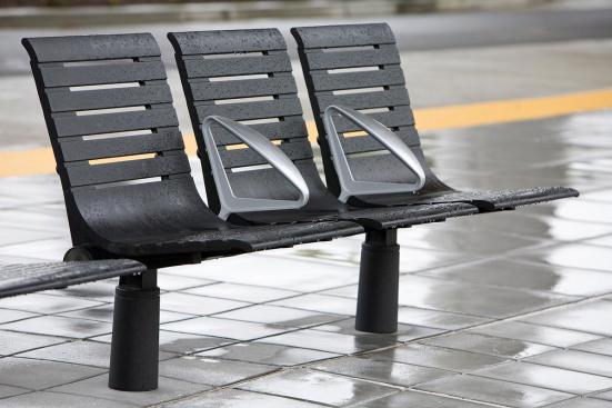 Tecno RS Seating System shown in three-seat, backed configuration with Black Texture powdercoated frame and seats, Silver Texture powdercoated angled armrests, and cylindrical mounting posts at Sound Transit, Seattle, Washington