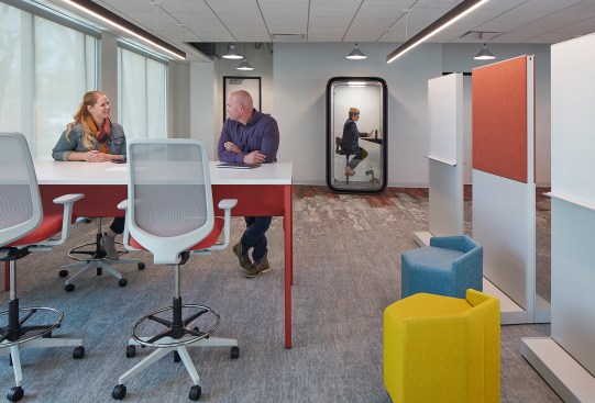 A variety of collaboration areas are scattered throughout the office.