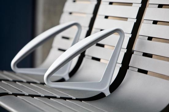 Tecno RS Seating System shown in three-seat, backed configuration with Black Texture powdercoated frame and seats, Silver Texture powdercoated angled armrests, and cylindrical mounting posts at Sound Transit, Seattle, Washington