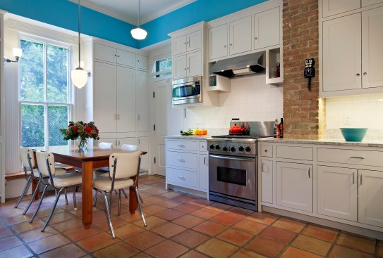 After: a new shallow tower cabinet houses the kid's gear and gardening supplies