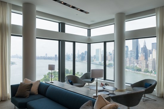 An amenity space for students on the 26th floor of The House at Cornell Tech, with views of the Manhattan skyline.