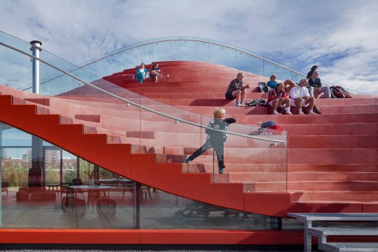 The terraced seating likens an amphitheater setup, but features alternating curves from top to bottom.&nbsp;