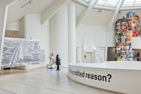 An image of the Zeestraat (Sea Street) by Constantijn Huygens, designed in 1653 to connect the Hague and the fishing village of Scheveningen, next to one of the cutout-figure robots that wander the exhibition