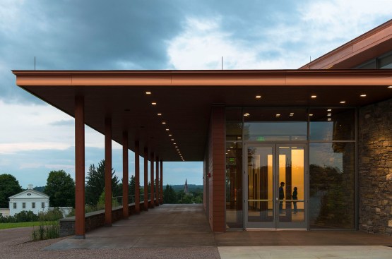 The cedar-lined porch provides views to the town's historic village and Museum campus.