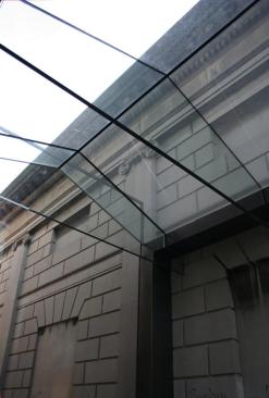 The walls, roof, and floor are all made from low-iron laminated glass, and the roof structure is supported by glass beams.