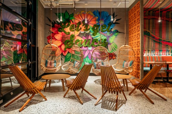 SuViche’s signature tag line “Let’s Get Saucy” is made of green moss and set against a custom floral graffiti wall by local artist.