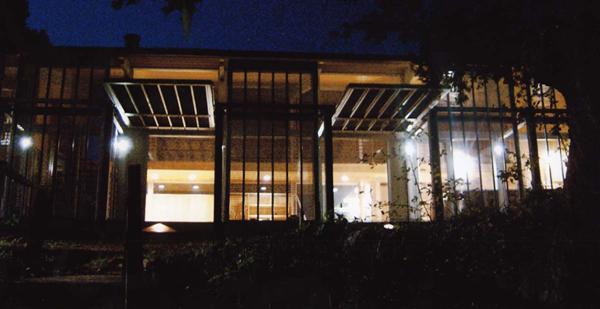 The screens sit about 12 feet out from the houses glass walls. Pushing them away from the home adds visual depth to open living spaces while creating a shady terrace overlooking Shim Creek.