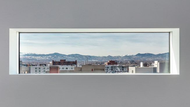 View of the Rocky Mountains from a window on level five of the Martin Building