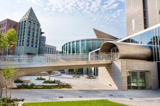 The new glassy welcome center flanks the Ponti building (right), the museum's Daniel Libeskind addition (one corner visible above), and the Michael Graves-designed Denver Central Library (left).