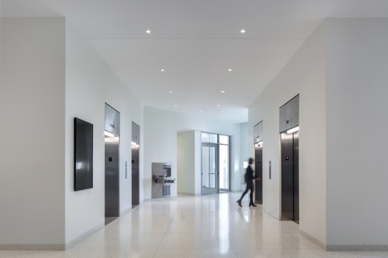 An elevator lobby on level five: The architects added two new shafts without compromising Ponti's original design.