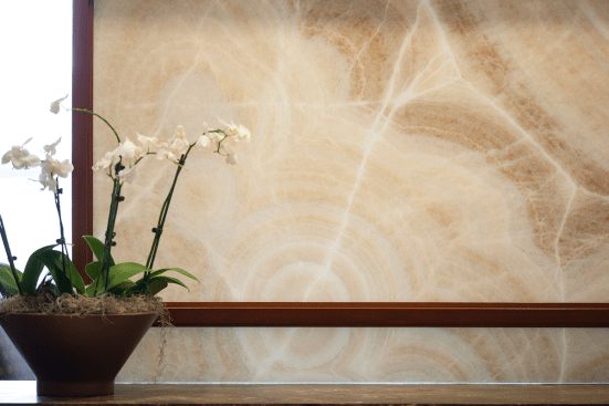 Partition in ViviStone Cream Onyx glass with Pearlex finish at Burr & Forman, Orlando, Florida