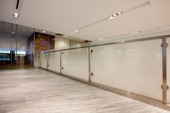 Railing infill in ViviGraphix Gradiance glass with Dot Mini Fade interlayer and Standard finish at HSBC Bank, New York, New York