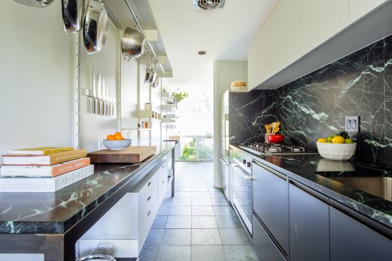 The firm re-created and reconceived Ludwig Mies van der Rohe’s signature design elements for this Detroit house renovation. In the kitchen, verde alpi marble acts as a nod to Mies’s use of the material in corporate lobbies.