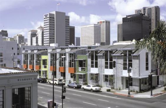 Businesses occupy the first floor of five of the buildings, providing another layer of eyes for security during the day. Sidewalk plantings and elevated stoops help to keep the street facades friendly.