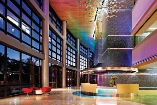 In the three-story main lobby and elevator core, patients are welcomes with shaded glass walls and LED-animated interiors.
