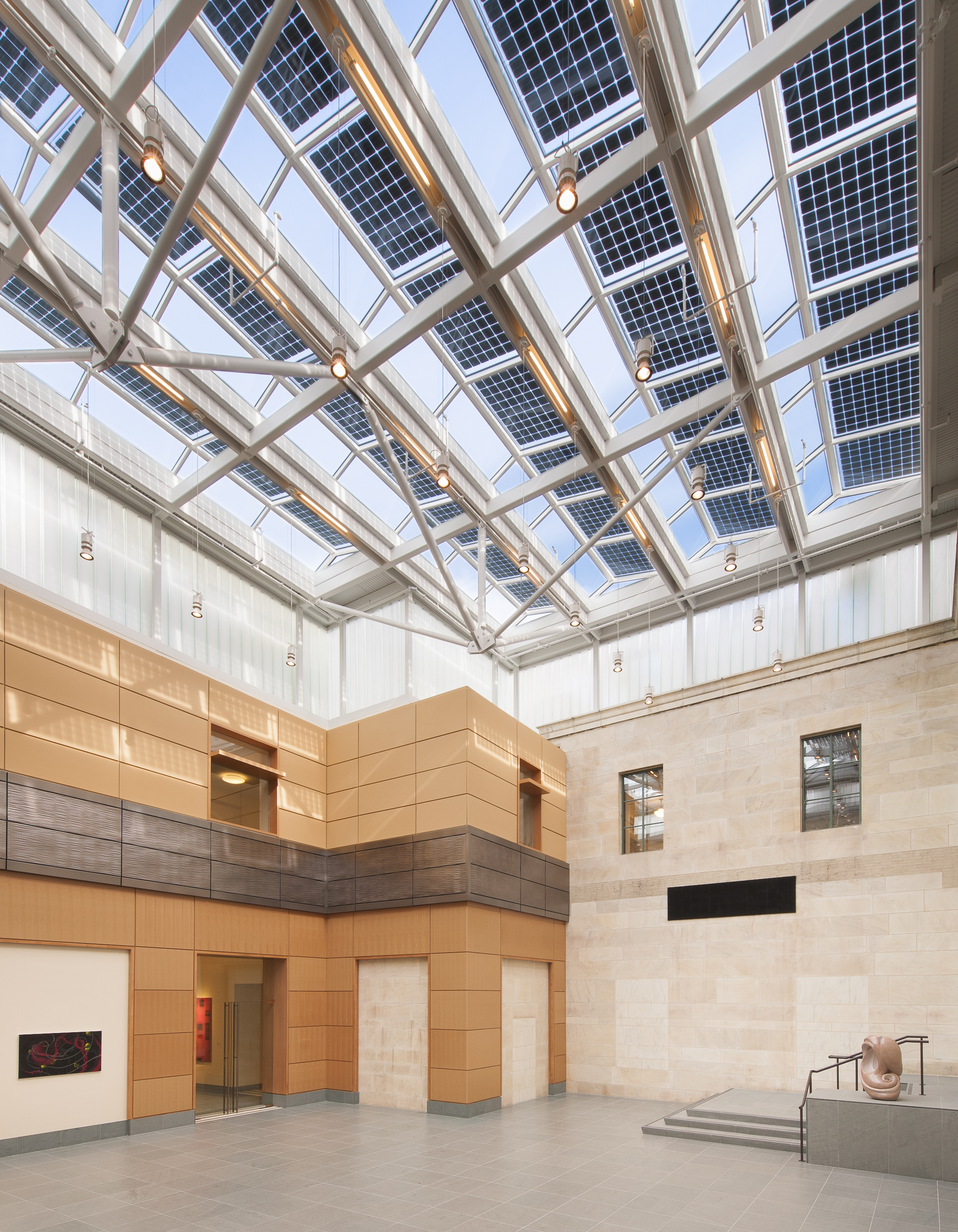 New light court with building-integrated photovoltaics in skylight