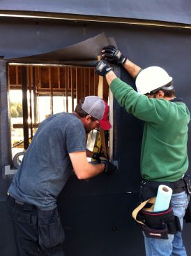 The same material was applied around the base of the structure, which was later covered with Hardie Board panels.