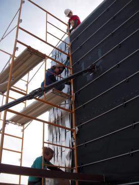 Each aluminum strip in the rainscreen was hand-woven through aluminum rods to form the overall basketweave effect.
