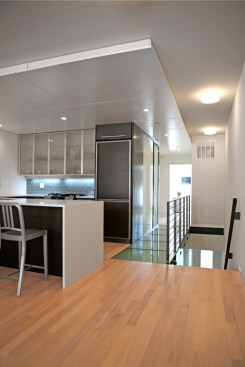 An eclectic mix of materials includes tigerwood, solid surface, and bamboo.
