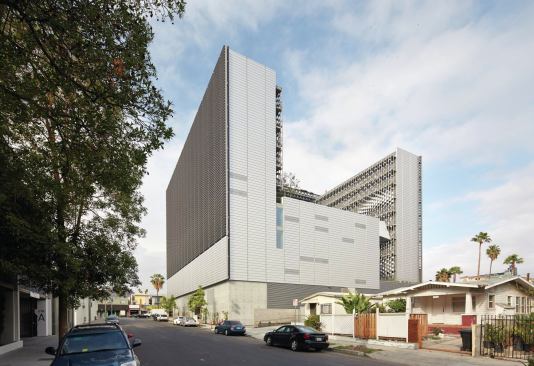 Two single-loaded residential towers present austere perimeter façades to the east and west. An automated system connected to weather stations that monitor temperatures and sun angle controls the horizontal sunshades. A high-performance glass curtainwall features operable windows in the dorm rooms. Rooftop solar panels on the west tower provide enough power to heat hot water for the entire complex, and each dorm room is equipped with a valence system that provides radiant heating and cooling. “The first way to deal with energy is to reduce the load,” Mayne says. “There isn’t much coming out of the office that isn’t [LEED] Gold or Platinum.”