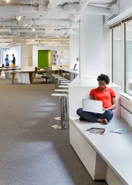 Flexible work areas include a bench at the end of the Link Desk that runs along the length of the space.