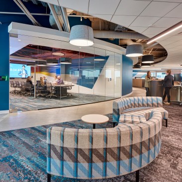 A large conference room with rounded glass enclosure.