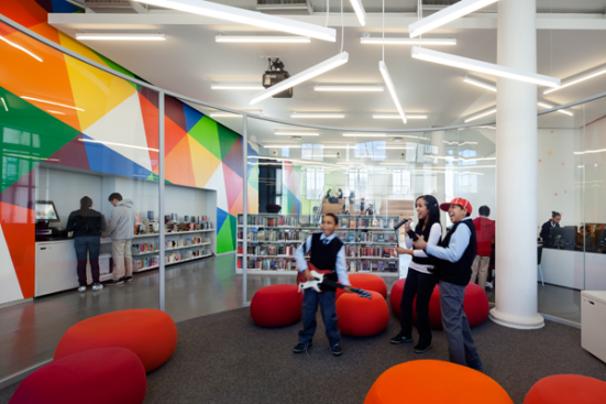 The Media Vitrine is a brightly-lit, highly visible central point of the library..