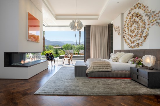 Serenity Indian Wells luxury desert home primary bedroom design with indoor outdoor access & views