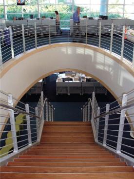 The bulk of the newspaper's employees work in the second and third floor newsrooms, connected by a large open stairwell to promote ready circulation between departments. The third floor ceiling is shaped by the folds of the roof, lending a sense of sculpture to the sea of cubicles. Interior paint - Porter Paints - www.porterpaints.com Available primarily as tinting bases to allow for exact color matching and custom color - Eggshell, matte, and various gloss options available - Coverage is approximately 400 square feet per gallon on smooth surfaces - Low odor - Soap and water clean-up Tru Colours modular carpet tile - Shaw Contract - www.shawcontractgroup.com Solution-dyed nylon carpet fibers - Ecoworx backing - Level-loop construction Concore-panel raised access floor - Tate Access Floors - www.tateaccessfloors.com Panels have a flat-top steel sheet welded to a formed-steel bottom sheet - Filled with lightweight cement available in 24-inch squares Ripple bench - Steelcase - www.steelcase.com Available with flat or wave tops - Optional ganging device to connect individual benches together - Designed by Laurinda Spear of Arquitectonica