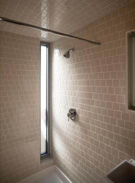 All non-floor tile in the bathroom shower was purchased for $100 from factory extras.