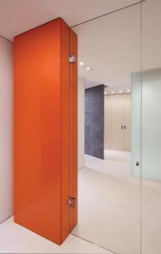 Bursts of color and floor-to-ceiling glass minimizes the pre-existing low, horizontal environment. 