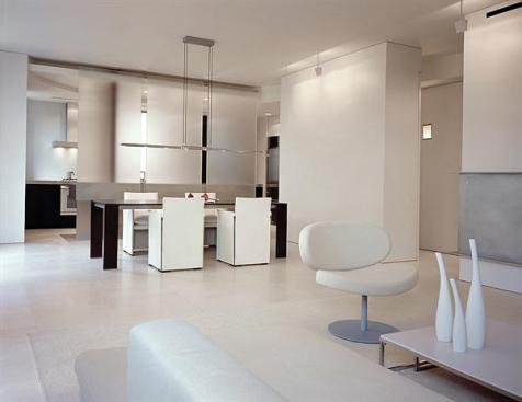 A limited palette of seamless materials give this apartment an orderly coherence.