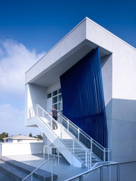Stair with West-facing vertical louver detail.